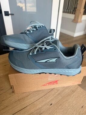 Altra Women's Trail Running shoes in slate Blue. $60